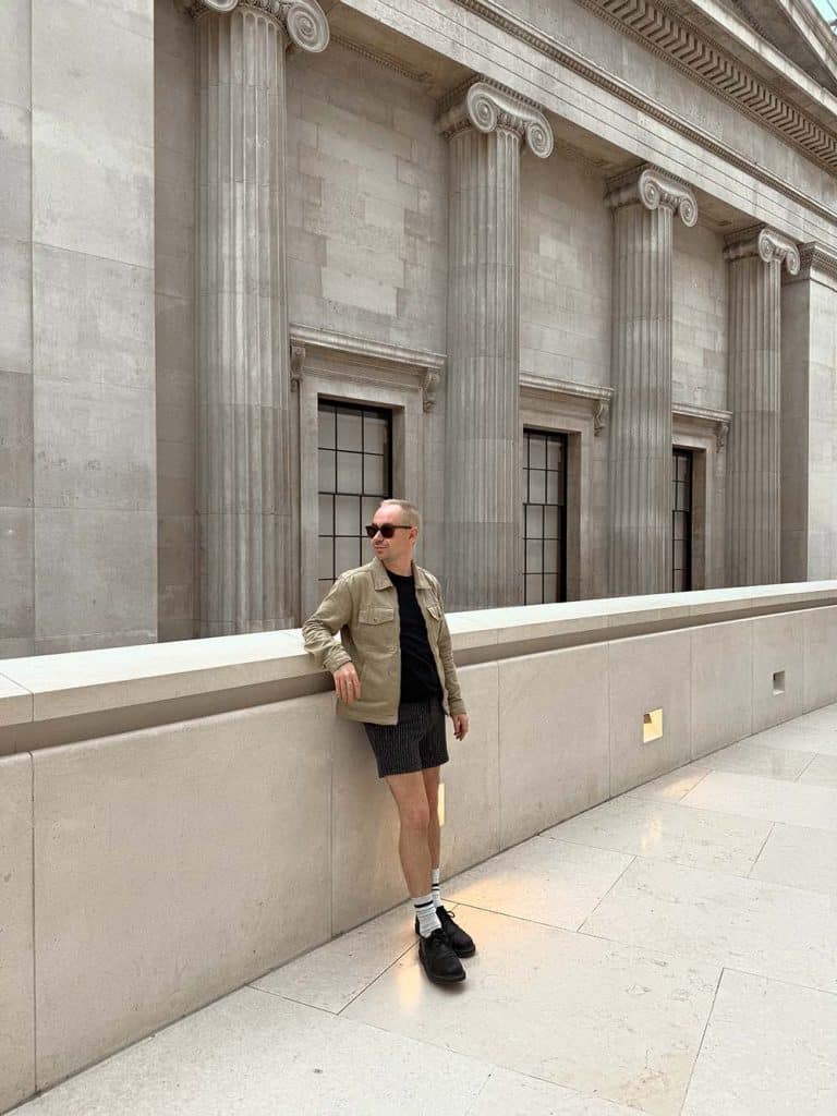 Photo of Owen Places stood in the British Museum in London