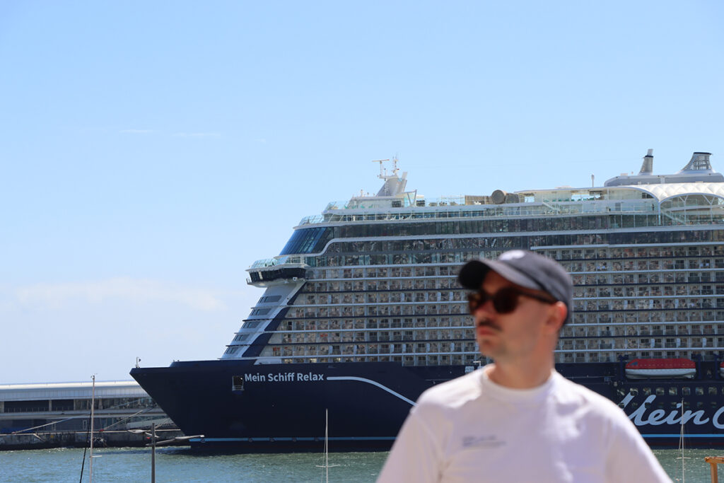 Owen in front of Mein Schiff Relax in Portugal