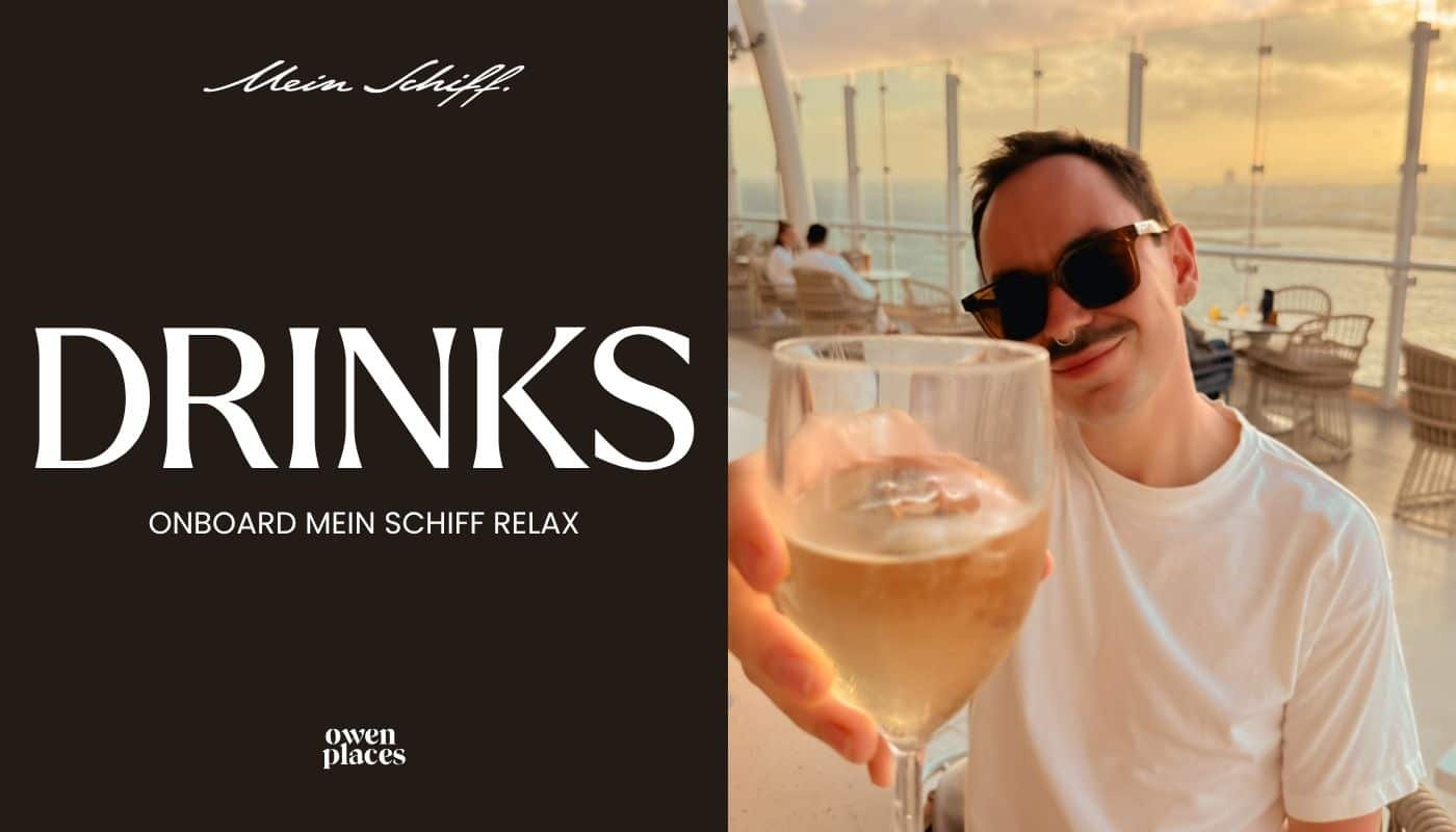 Owen 'cheersing' with a glass of wine onboard Mein Schiff Relax