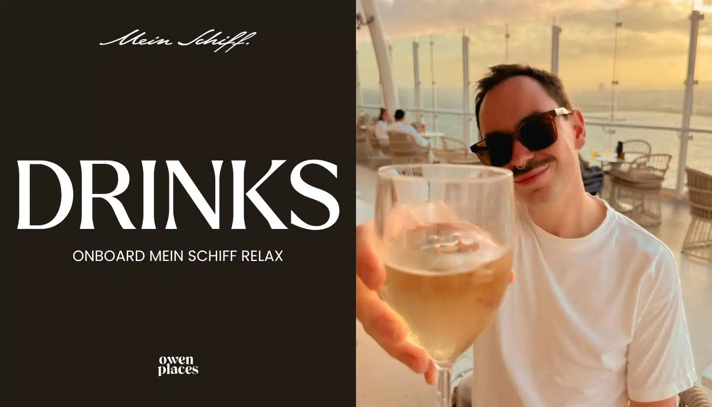 Owen 'cheersing' with a glass of wine onboard Mein Schiff Relax