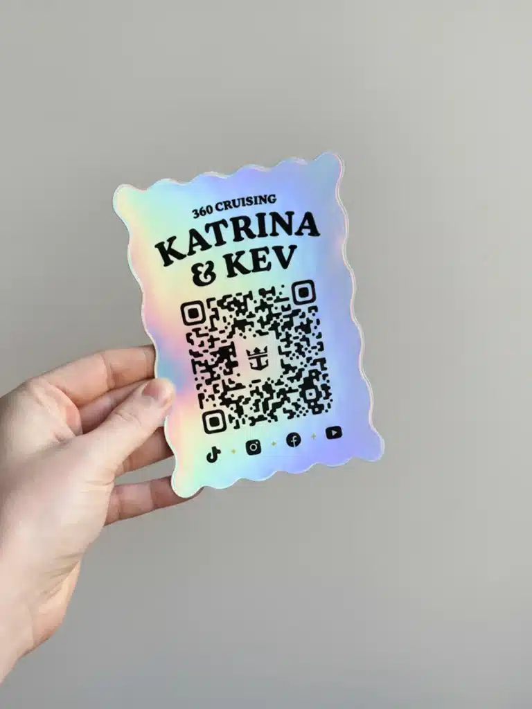 Iridescent scalloped card reading '360 CRUISING KATRINA & KEV' with a QR code, held by a hand, showing social icons at bottom.